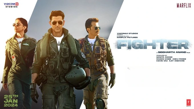 A vibrant Bollywood movie poster for 'Fighter' featuring the lead actor in a pilot's uniform with a backdrop of fighter jets.